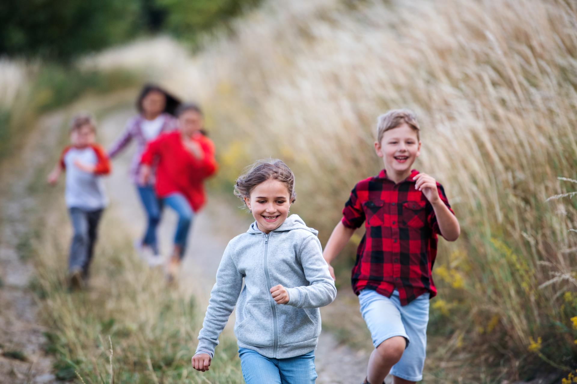 Kids running on a trail