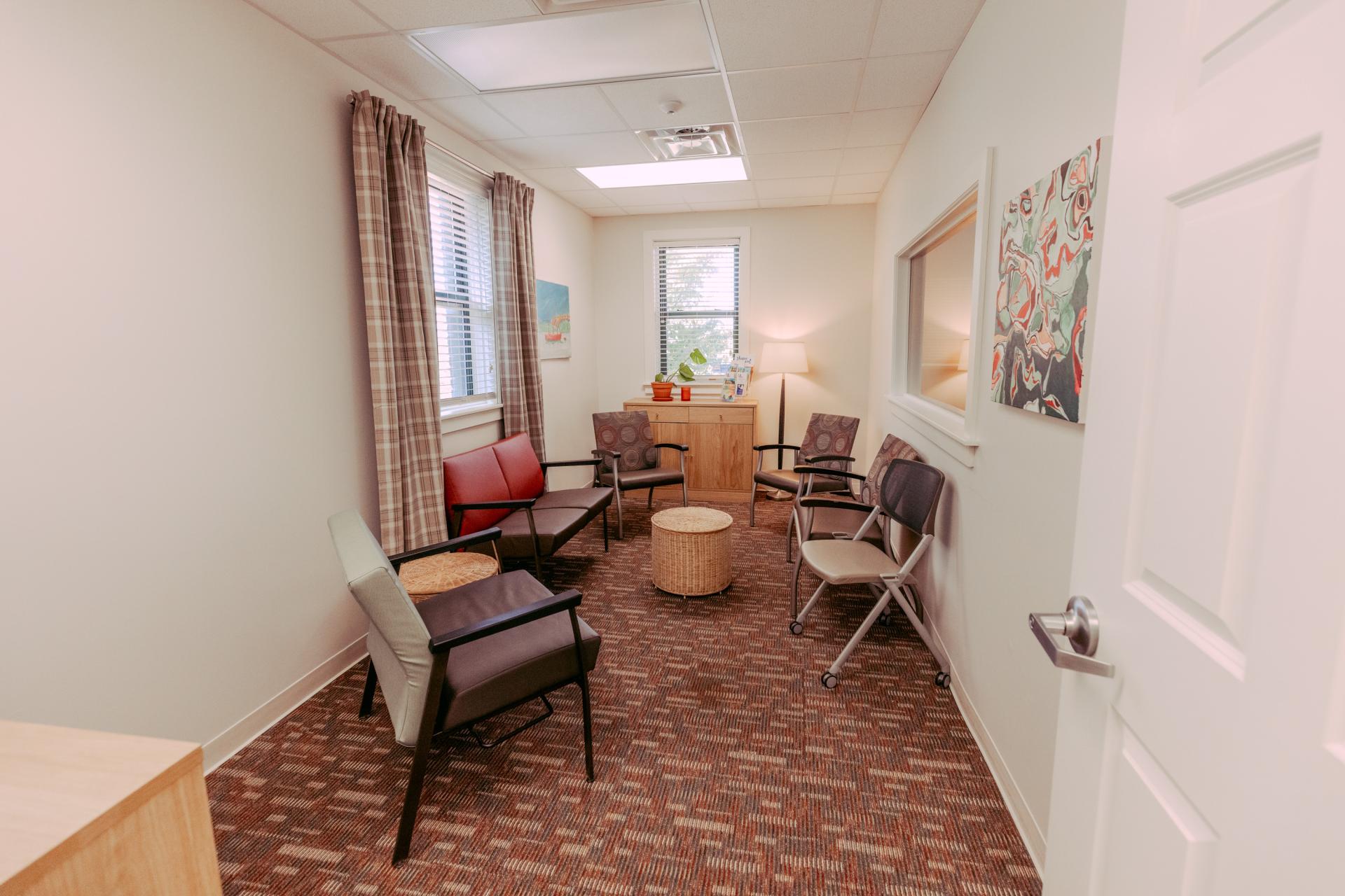 room at the CAC with chairs and a one-way mirror